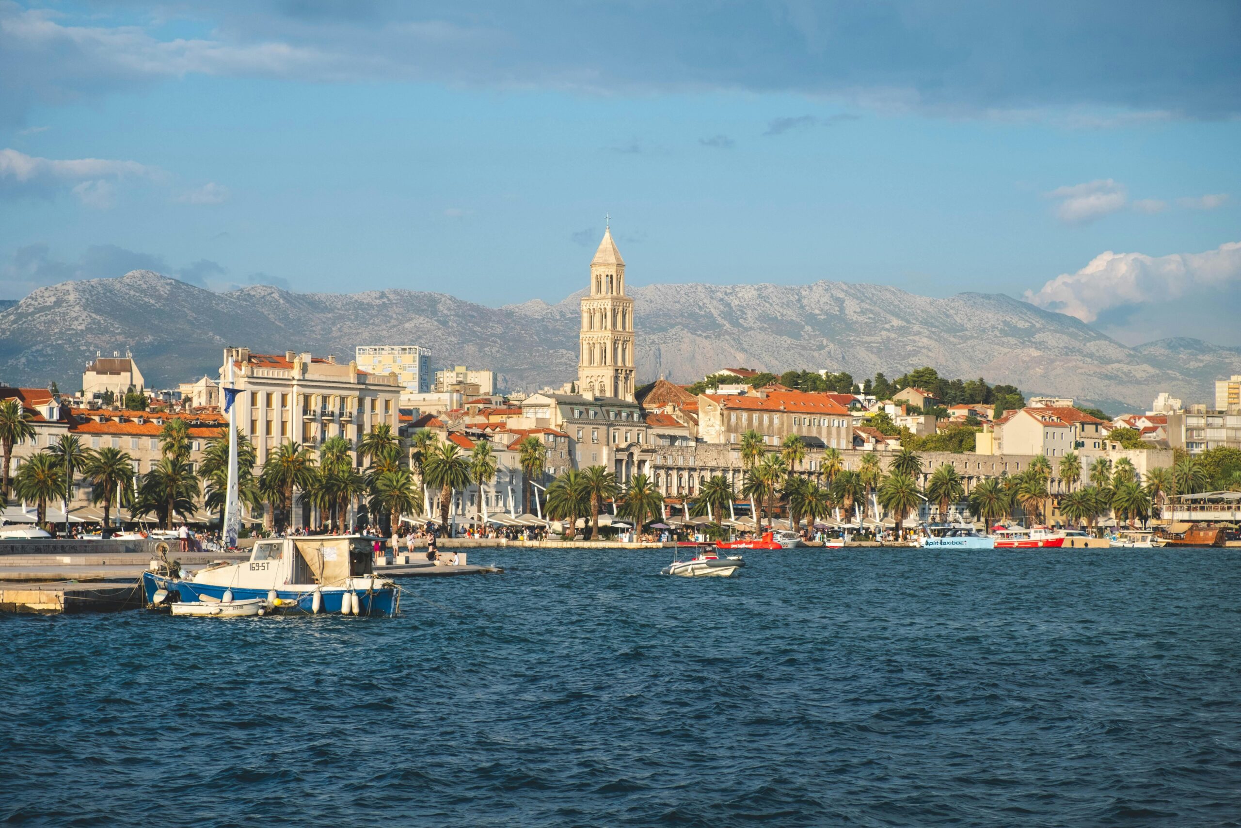Stunning view of Split's old town and waterfront with mountains in the background, ideal for travel inspiration.