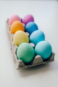 Vibrant pastel Easter eggs arranged in a carton, ideal for holiday decoration ideas.